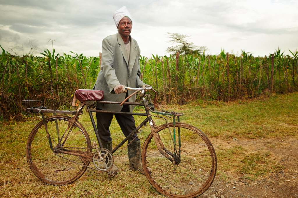  Title: Commute to Work Photographer: Christoph Siegert Location: Fiwagoh Mission. Gilgil, Nakuru, Kenya. 2016 Description: A laborer is about to go home after working in our Kitechild funded greenhouses at the Fiwagoh MIssion. This project has provided steady employment to members of the surrounding community as they work on the farm, and learn to cultivate their own smaller farms at home. 